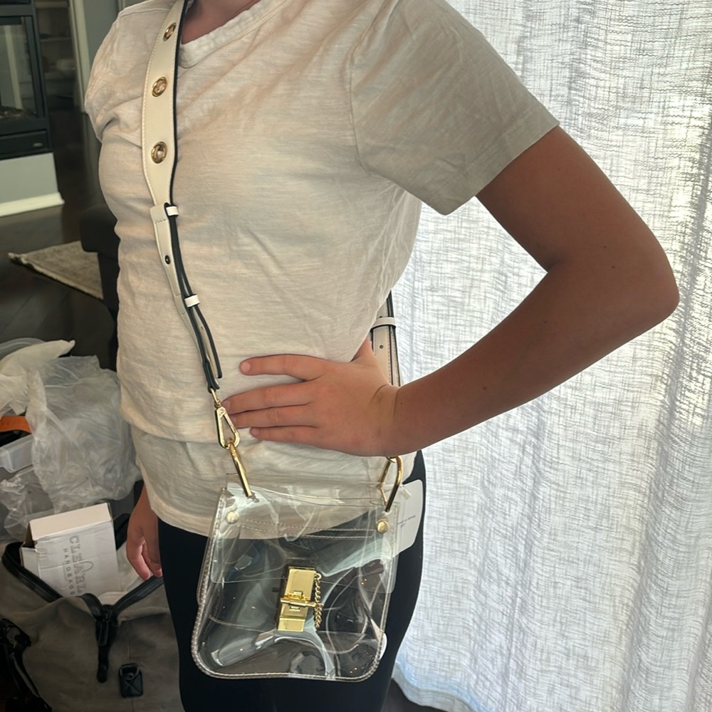 Beautiful white leather strap clear bag.